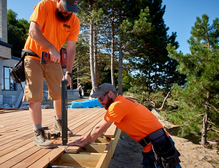 Contractors installing decking with DRIVE tool